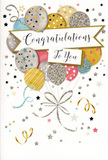 The photo presents a refined congratulations card propped upright, its design echoing the sense of quiet celebration you might feel after good news shared near Blackwall's riverside. The front is dominated by a generous spray of illustrated balloons, gathered tightly together much like a carefully composed floral display. These balloons come in an inviting palette of metallic gold, silver, champagne, blush pink, cool blue, and misty grey, each with a slightly different finish-some appear satin-smooth, others dusted in glitter, and a few adorned with petite stars or linear patterns. Their softly rounded shapes overlap so they seem to float forward from the card, their slim strings sweeping downward in a graceful tangle of gold and silver lines reminiscent of curling ribbon wrapped around a celebratory bouquet. Cutting across the centre, a gently arched banner carries the words Congratulations To You in flowing, stylish calligraphy, the lettering poised between formal and friendly, ideal for both personal and professional milestones. The background is a pale, uncluttered canvas scattered with tiny metallic stars, curling streamers, and confetti-like flecks, which add movement and sparkle without overwhelming the eye. This scattering feels like the final moments of a celebration-the echo of cheers after an exam success, a promotion, or a new beginning in one of the nearby developments around Blackwall. The overall mood is jubilant yet polished, making the card a perfect partner for a fresh, uplifting floral gift, ready to be delivered to someone whose achievements deserve to be recognised and remembered.